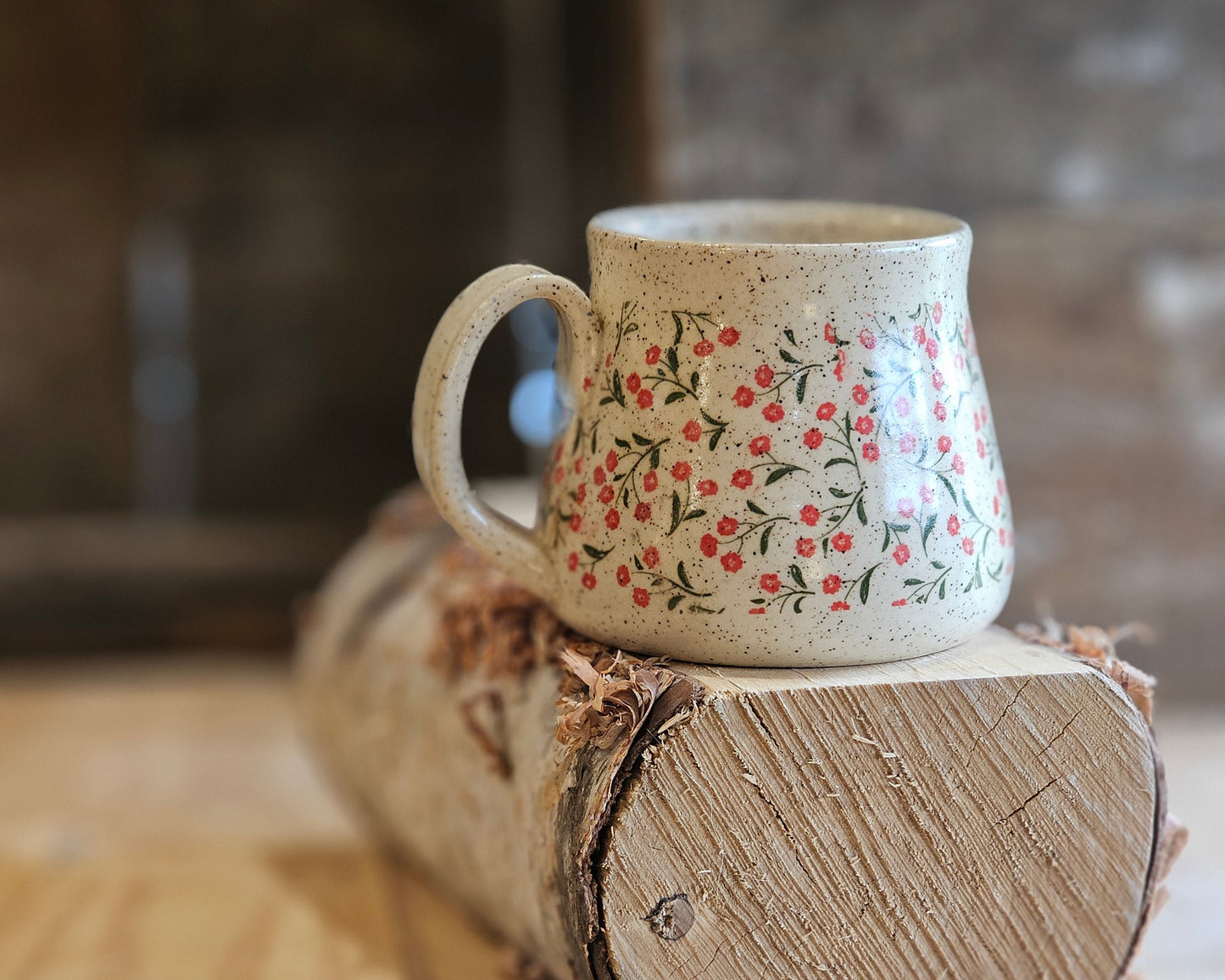 full bellied wheel thrown handmade mug, tiny red flower and green stems, unique, made in northern Idaho