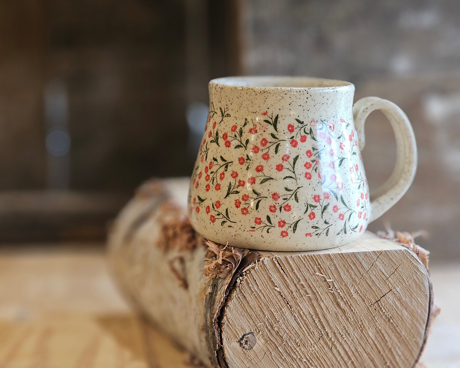 full bellied wheel thrown ceramic mug, tiny red flower around, uniquem, made in northern Idaho