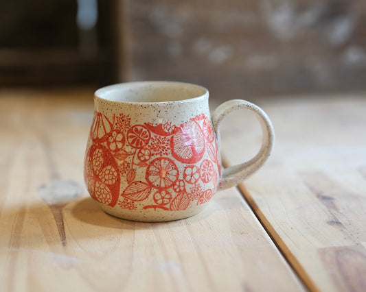 Cheerful citrus design in red on full bellied mug - handmade in northern Idaho
