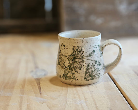 Full bellied ceramic mug in a green daisy design - made in Idaho
